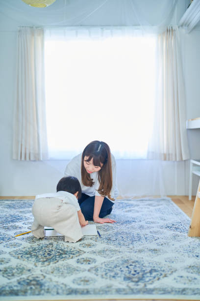 istock Parent and child playing with drawing 1451427867