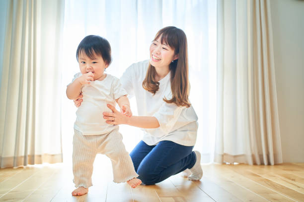 istock Parent and child playing in the room 1451429735