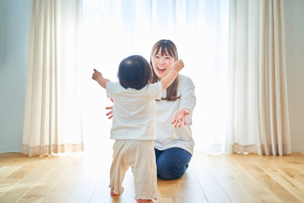 istock Parent and child playing in the room 1451429861
