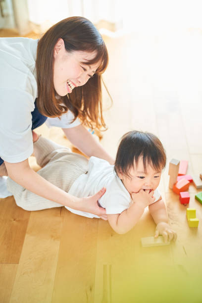 istock Parent and child playing in the room 1451430415