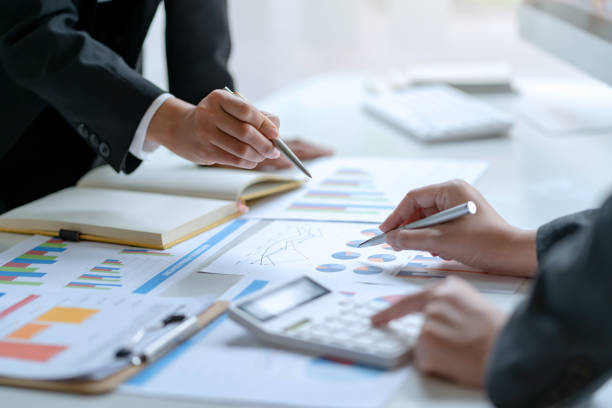 istock Business people meeting working project developing business strategy doing paperwork analysis in office. 1451430584