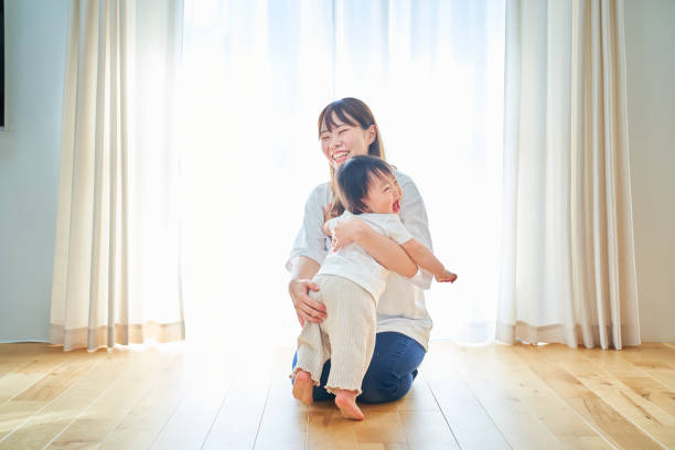 istock Parent and child hugging in the room 1451431094