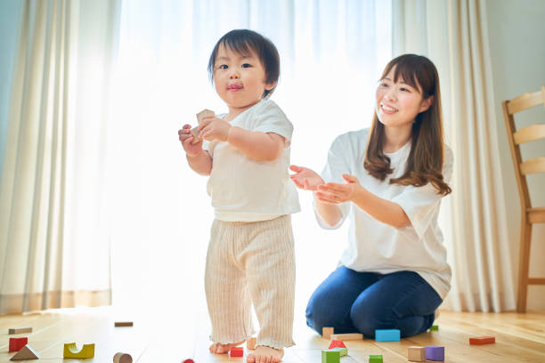 istock Mother and child playing with building blocks 1451431683