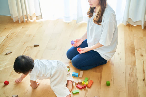 istock Mother and child playing with building blocks 1451432647