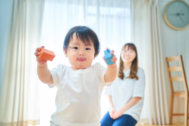 Mother and child playing with building blocks