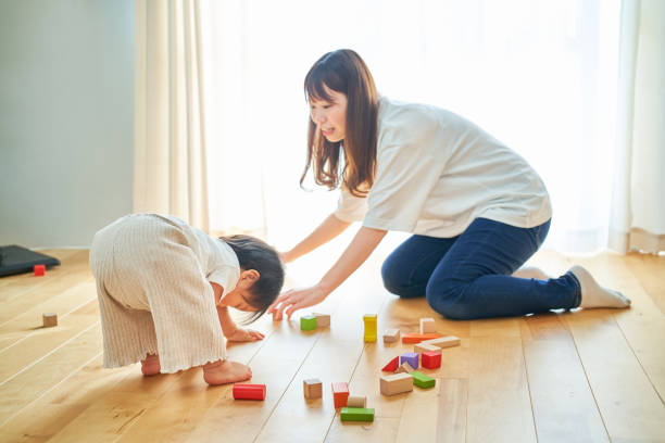 istock Mother and child playing with building blocks 1451433158