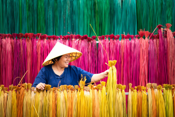 istock Processing of flax trees into different colors to be weaved into mats. 1451434598