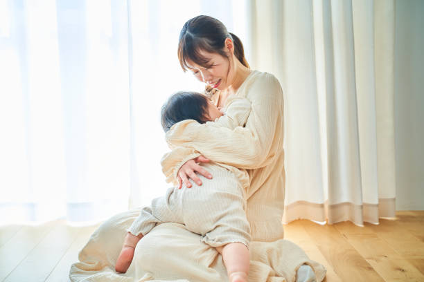 istock Parent and child hugging in the room 1451436090