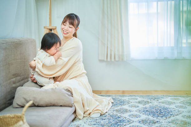 istock Parent and child hugging in the room 1451436366