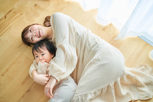 mother and child hugging in the room
