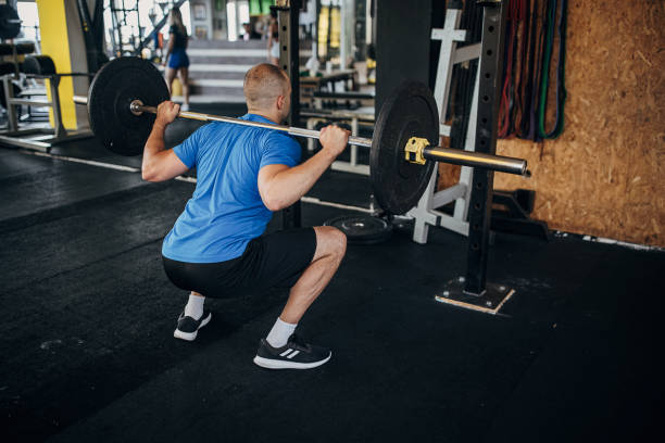 istock Man weightlifting in gym 1451439471