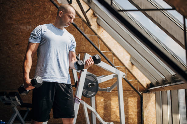 istock Man weightlifting in gym 1451440195