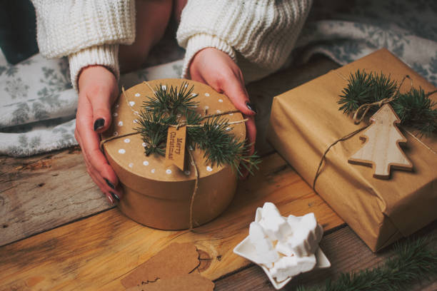 istock Woman decorating Christmas presents 1451441530