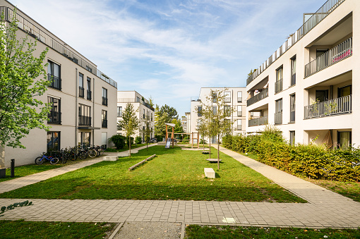 Cityscape of a residential area with modern apartment buildings, new green and sustainable urban landscape in the city for families