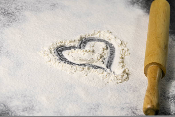 istock a heart is drawn on the scattered flour. An old rolling pin is nearby. culinary layout 1451450842