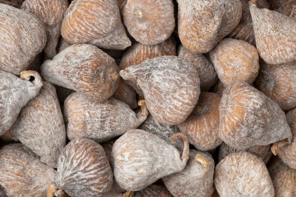 istock Sweet dried small spanish figs close up full frame 1451455291