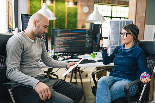 Software Programmers Analyzing Database And Script Ideas Male And ...