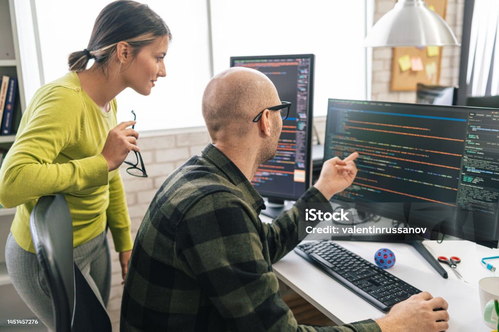 Software Programmers Analyzing Html Code And Database Brainstorming ...