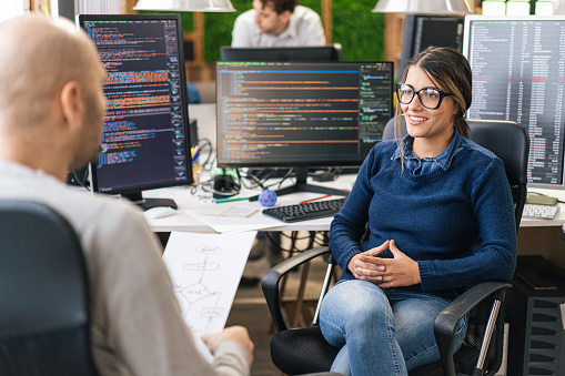 Software Engineers Having Discussion On A Coding Topic Checking On Some ...