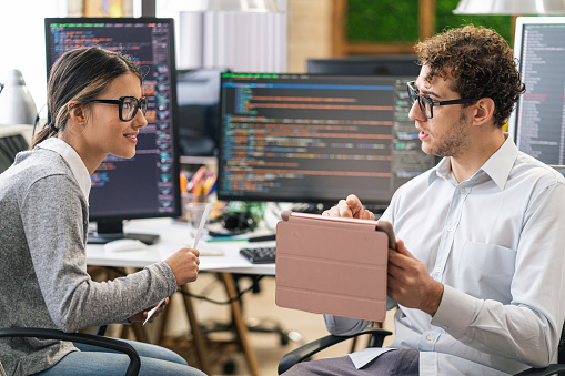 Software Programmers Analyzing Html Code And Database Brainstorming ...