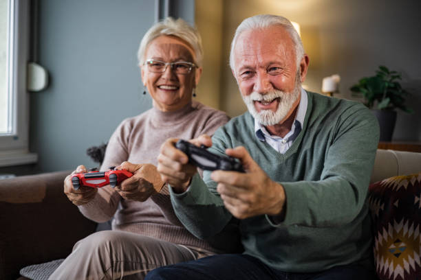 istock Senior couple playing video games 1451463242