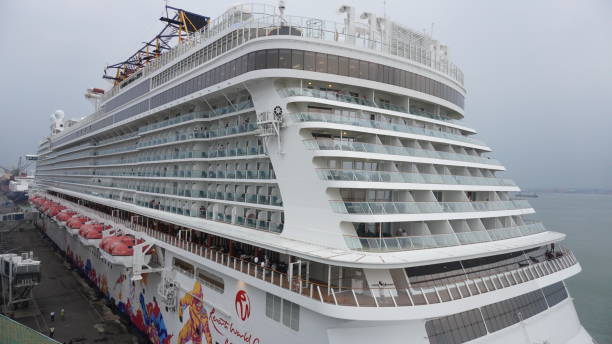 genting dream cruise ship at tanjung perak harbor, surabaya. the tourists are very happy to travel around the city. the ship ready to depart - depart imagens e fotografias de stock