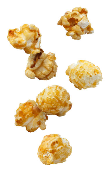 istock Flying delicious caramel popcorn on white 1451464836