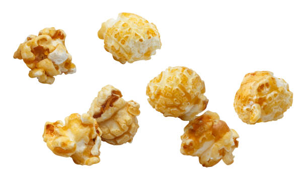 istock Flying delicious caramel popcorn on white 1451465040