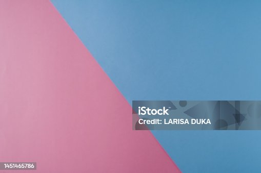 istock Background of blue and pink paper of pastel colors, geometric pattern. 1451465786