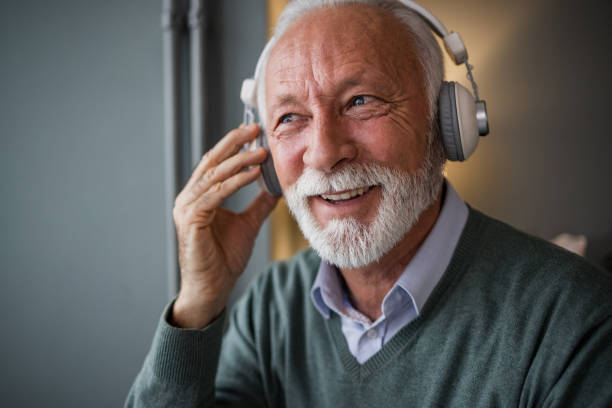 istock Senior man enjoying music 1451466812