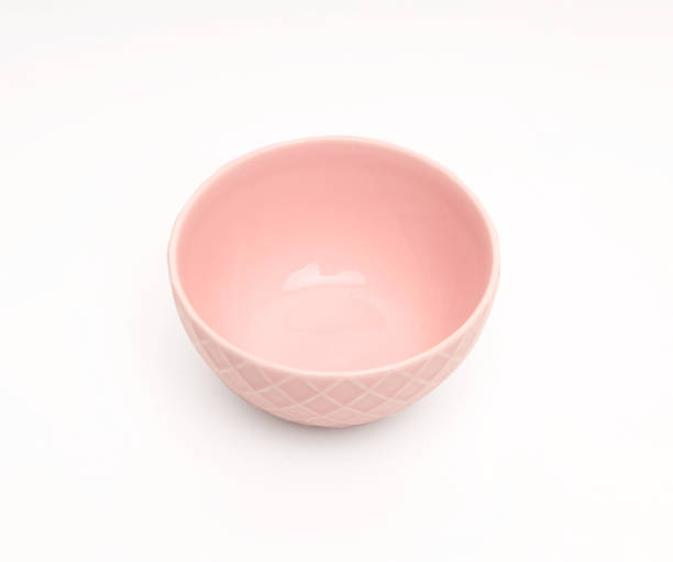 istock Pink bowl with checks on white background. 1451468271