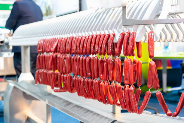 istock sausage chain during hanged on sausage hanging line of modern automatic machine for manufacturing process in food industrial 1451469198