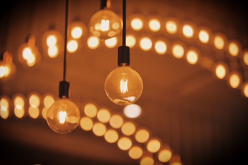 A closeup of some orange lightbulb with a beautiful bokeh background.