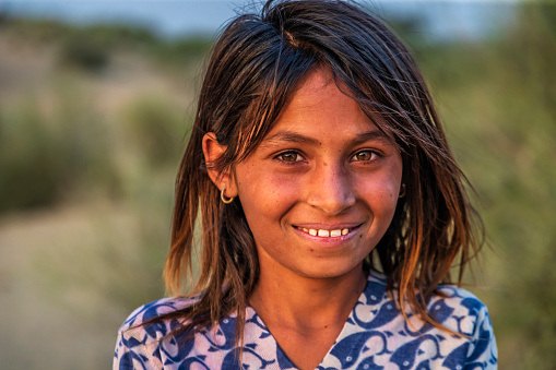 Happy Gypsy Indian girl from desert village, Thar Desert, Rajasthan, India