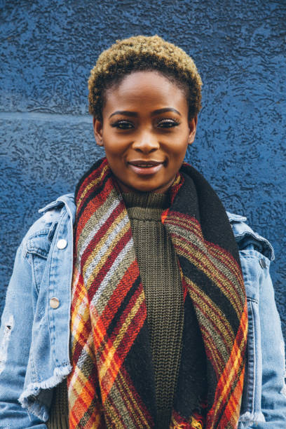 istock Woman portrait against a blue wall 1451478902
