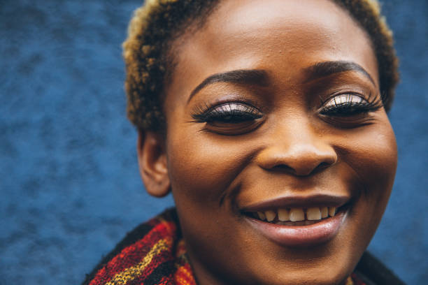 istock Woman portrait against a blue wall 1451480131
