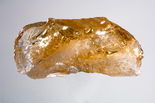 Topaz crystal isolated on the white background.