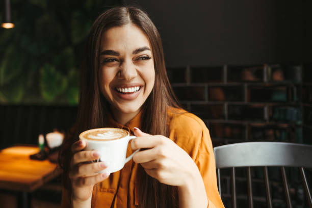istock Young woman drinking first morning coffee 1451480701