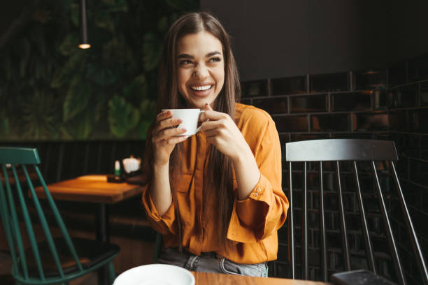 istock Young woman drinking first morning coffee 1451480792