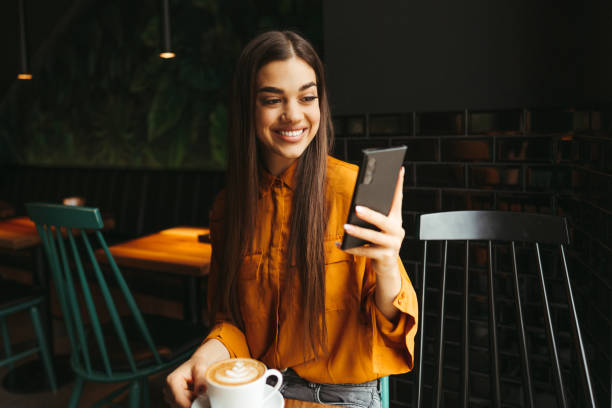 istock Young woman drinking first morning coffee 1451480795