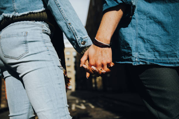 istock Lovely couple embracing in the streets 1451481105