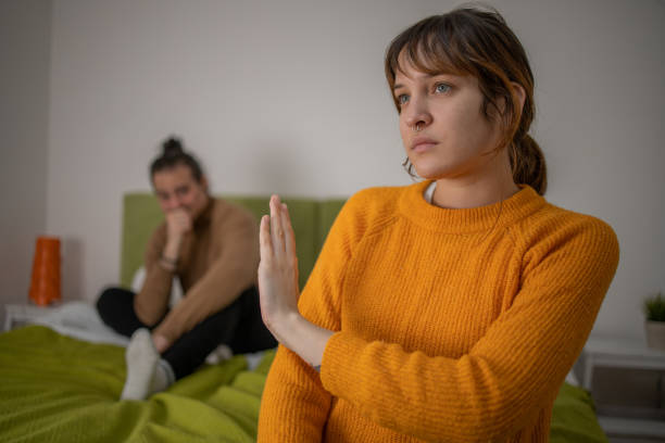 Upset woman thinking about relationship problems stock photo