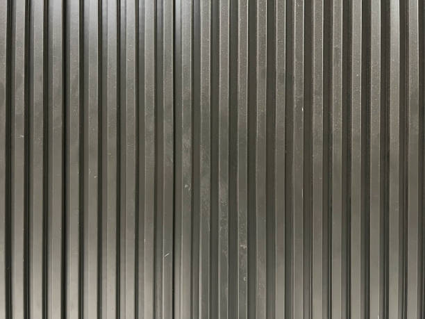 istock Black corrugated aliminium metal texture pattern 1451489847