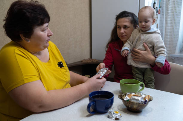 istock The woman takes pills from her daughter's hands. 1451491348