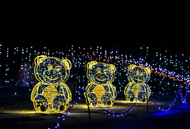 Denver, Colorado - December 15, 2022: Colorful Christmas decorations LED strip lights against the night sky in the Christmass in Colour attraction in Denver, Colorado
