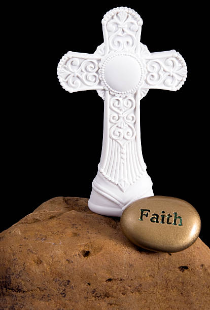istock Cross on Rock with Faith Stone 145150756