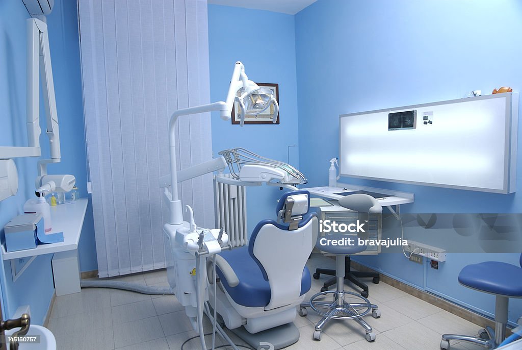 Dentist's room A dentist's chair in the medical room Blue Stock Photo