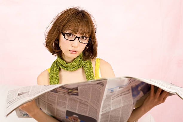 istock Japanese woman reading the paper 145150973