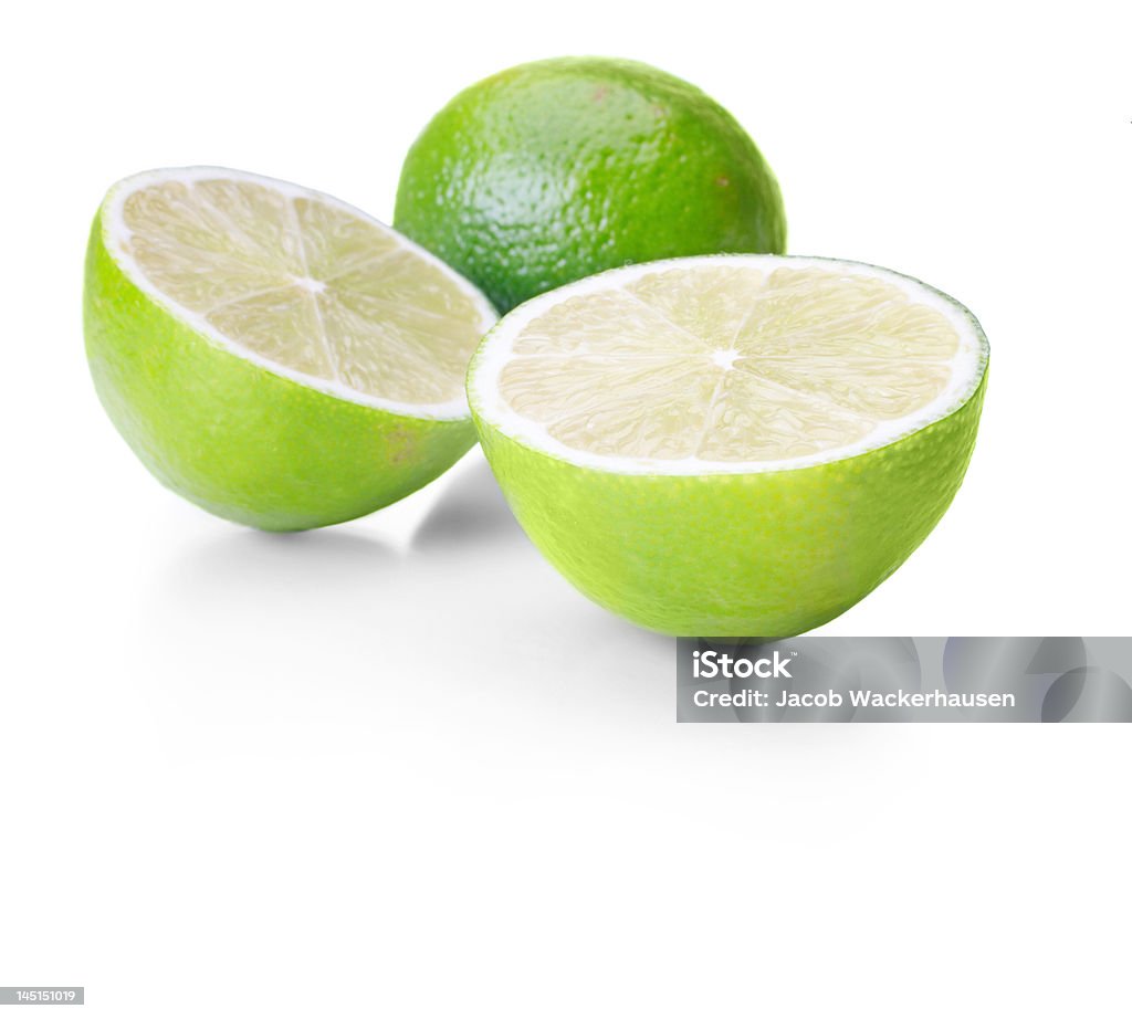 Close-up di lime su sfondo bianco - Foto stock royalty-free di Acido