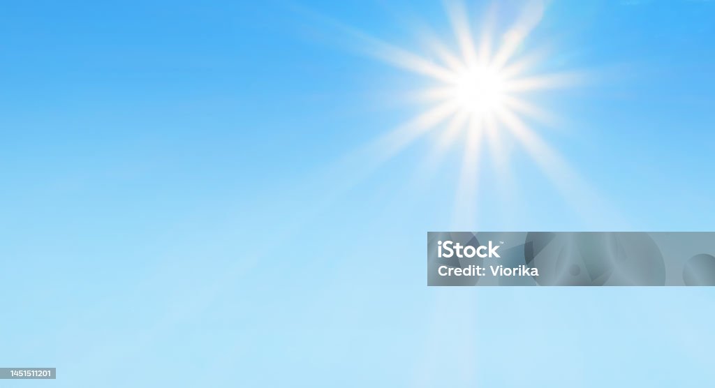 Bright sun with beautiful beams in a blue sky Bright sun with beautiful beams in a blue sky. Space for copy. Sky Stock Photo